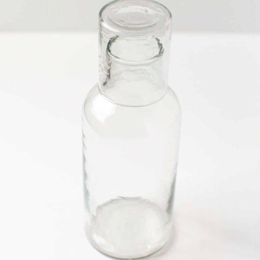 Clear glass bottle on a white background