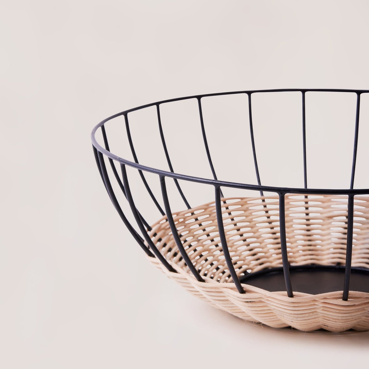 Wire and wicker basket on a light background