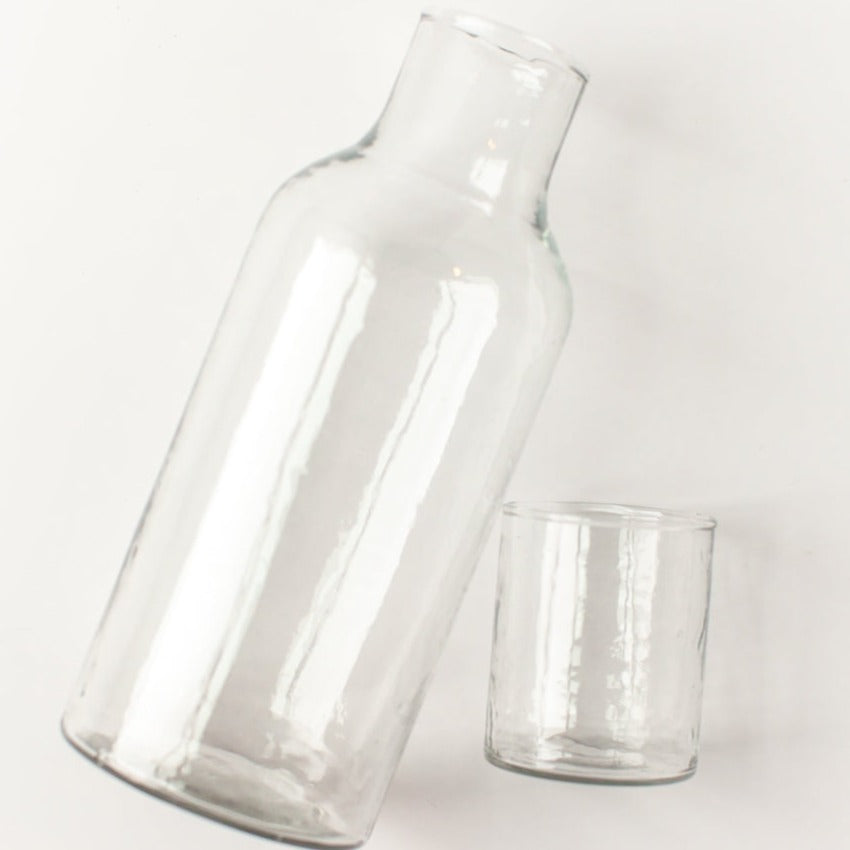 Two clear glass containers on a white background
