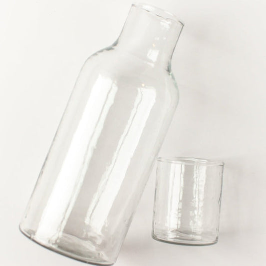 Two clear glass containers on a white background