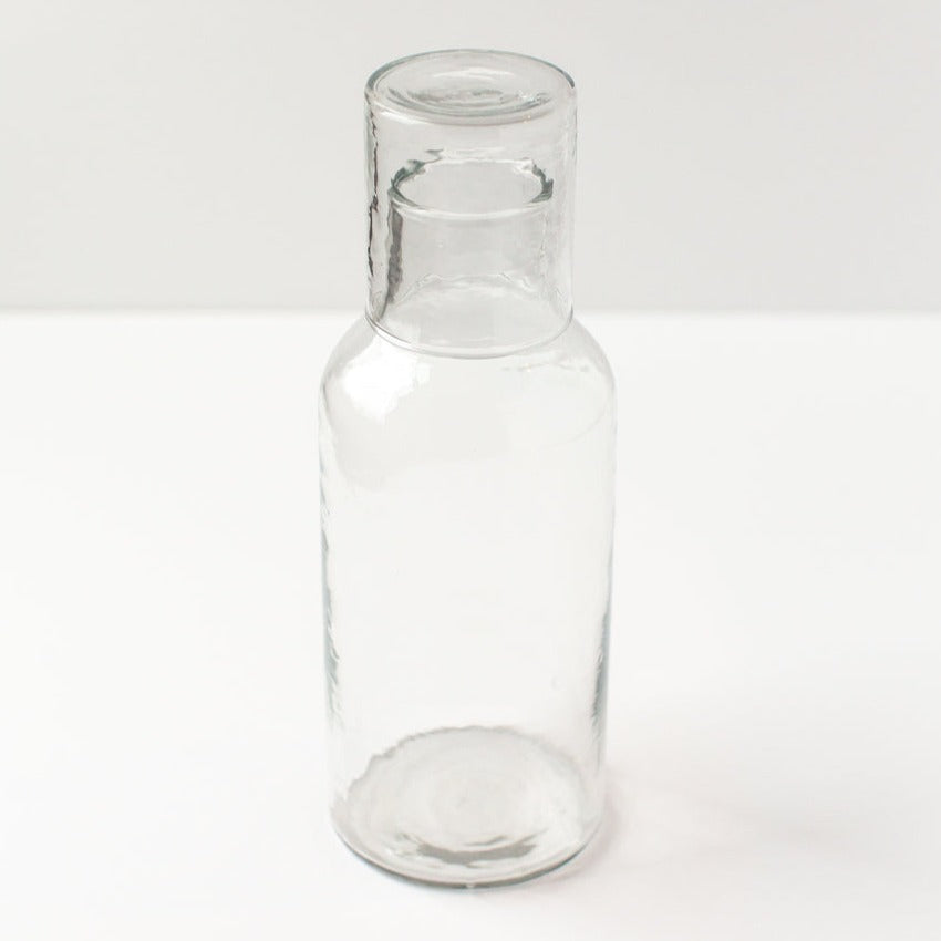 Clear glass bottle on a white background