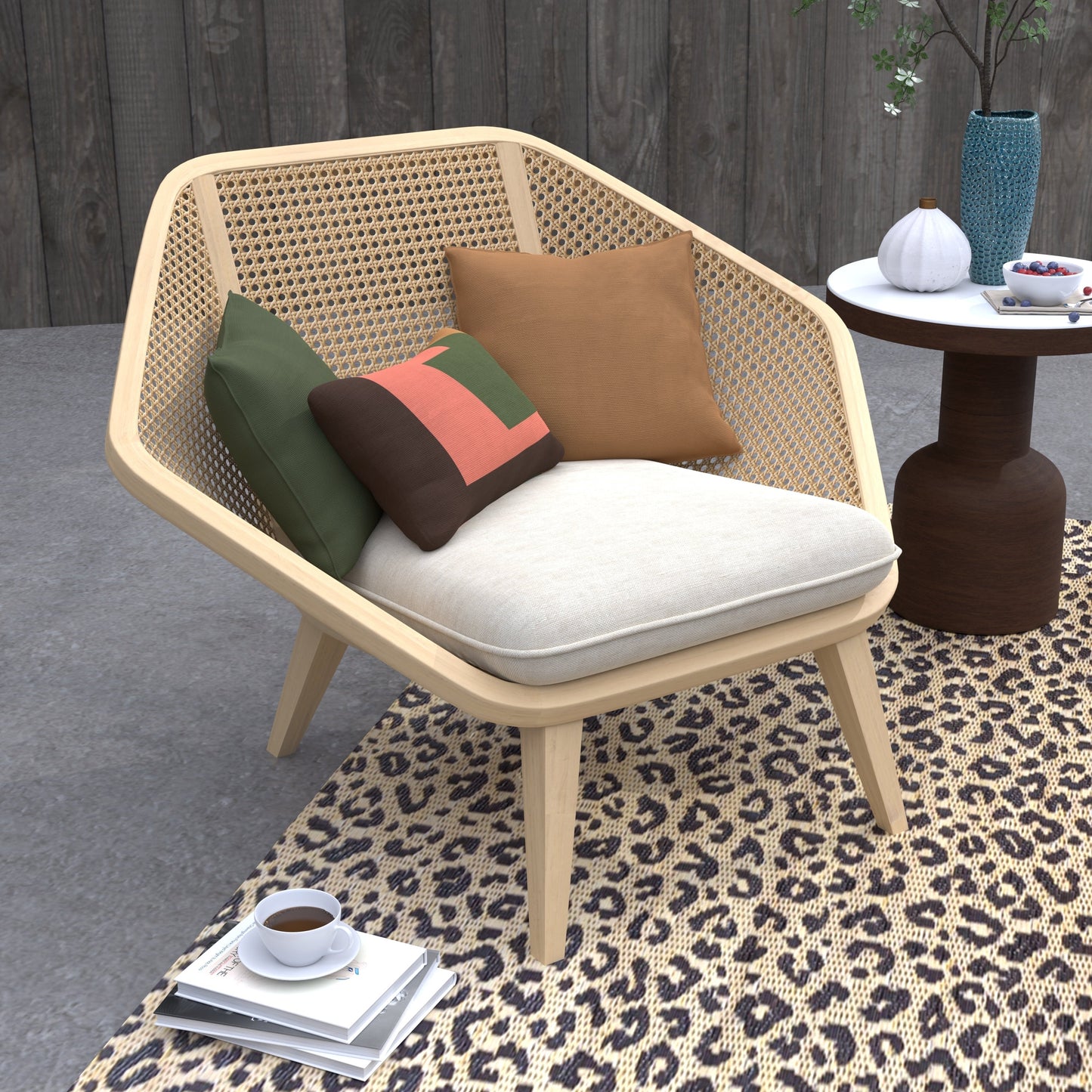 Wicker chair with cushions on a leopard print rug, next to a small table with decor items.