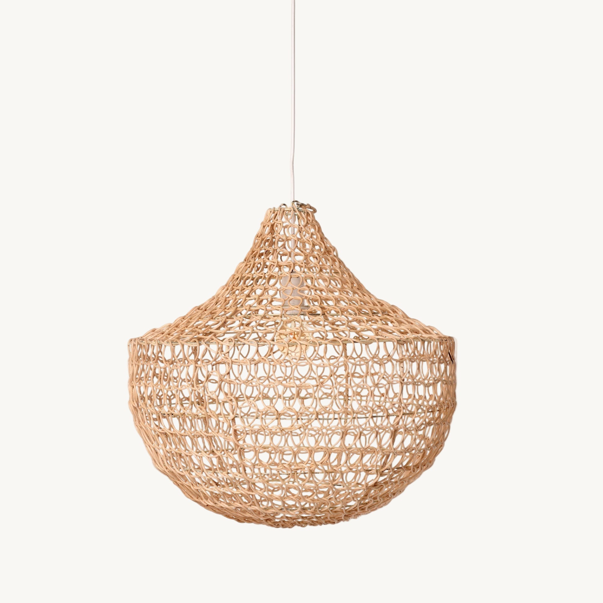 Woven rattan pendant light on a white background