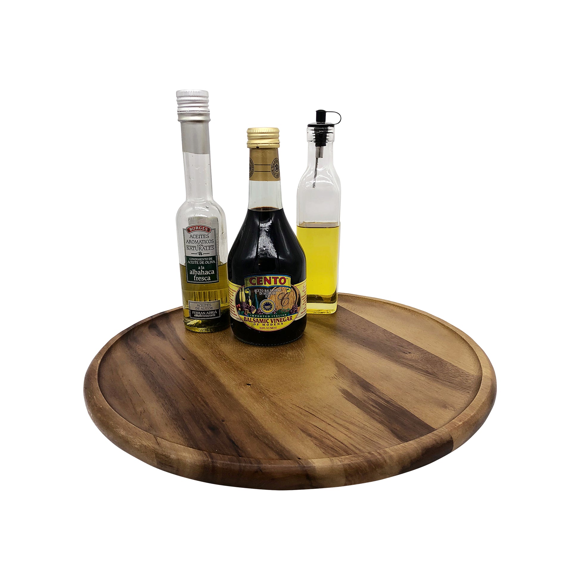 Three bottles of olive oil on a wooden tray with a white background