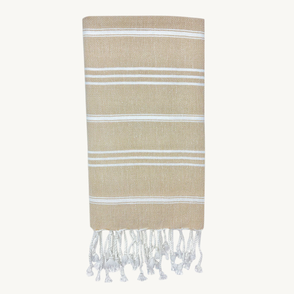 Beige towel with white stripes and fringes on a white background